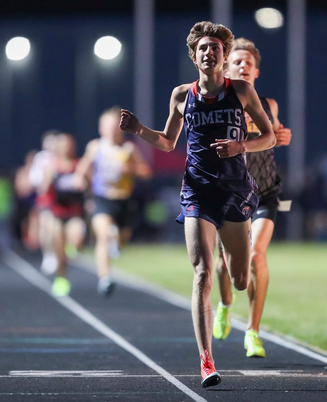 Owen Lencki leading a race under the lights